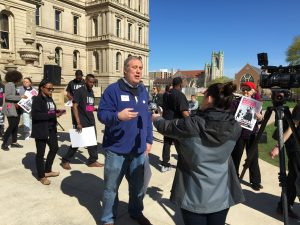 Josh giving an interview at the Clean Slate event in Lansing in April 2019